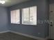 Bright living room features modern tile flooring, fresh paint, and abundant natural light from windows at 5144 Picadilly Circus Ct # 2, Orlando, FL 32839