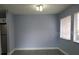 Open-concept room featuring tile flooring, neutral paint, ample windows, and abundant natural light at 5144 Picadilly Circus Ct # 2, Orlando, FL 32839