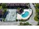 Aerial view of community pool and tennis courts in a condo complex at 5144 Picadilly Circus Ct # 2, Orlando, FL 32839