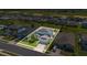 Aerial view of a lovely home with solar panels, fenced yard and manicured landscaping at 5225 Tuscany Ln, Davenport, FL 33897