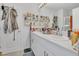 Bathroom featuring double sinks with a white countertop and ample storage space at 5225 Tuscany Ln, Davenport, FL 33897