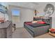 Comfortable bedroom featuring recessed lighting, wood floors, and a full-wall headboard with shelving at 5225 Tuscany Ln, Davenport, FL 33897