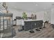 Modern kitchen featuring white cabinets, sleek countertops, stainless steel appliances, and bar seating at 5225 Tuscany Ln, Davenport, FL 33897