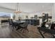Bright kitchen and dining area featuring modern appliances, a bar, and access to the outdoors at 5225 Tuscany Ln, Davenport, FL 33897