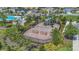 Community playground nestled amongst mature landscaping and a secure fence for added safety at 5225 Tuscany Ln, Davenport, FL 33897