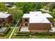 Aerial view of the townhouse and fenced patio with ample parking and well maintained grounds and landscaping at 5251 Brook Ct # 242, Orlando, FL 32811