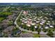 Townhome complex with clubhouse, pool and tennis courts within a community with mature trees and landscaping at 5251 Brook Ct # 242, Orlando, FL 32811