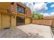 Backyard features a door to enter the property, a small balcony, and a concrete patio at 5251 Brook Ct # 242, Orlando, FL 32811