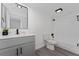 Bathroom features a vanity with grey cabinets and a tub and shower combo at 5251 Brook Ct # 242, Orlando, FL 32811