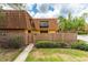 Charming townhome featuring a fenced yard, balcony, and well-maintained landscaping and beautiful blue sky at 5251 Brook Ct # 242, Orlando, FL 32811
