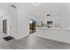 Open kitchen area with white cabinets, stainless steel appliances, and outdoor access at 5251 Brook Ct # 242, Orlando, FL 32811