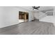 Bright living room featuring wood-look flooring, large sliding glass doors to the outdoor patio at 5251 Brook Ct # 242, Orlando, FL 32811