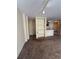 Open living room with tan carpet, built-in shelves, and a breakfast bar, perfect for entertaining at 6169 Metrowest Blvd # 208, Orlando, FL 32835