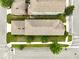 Bird's eye view of a home featuring a manicured lawn, mature trees, and clean sidewalks at 6834 Habitat Dr, Harmony, FL 34773