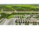 Spacious community with beautiful green landscaping, lush trees, and picturesque scenery at 6834 Habitat Dr, Harmony, FL 34773