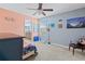 Spacious bedroom features neutral carpet, ceiling fan, and adjoins the bathroom at 6834 Habitat Dr, Harmony, FL 34773