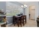Dining nook features a wood table set and bright lighting at 6834 Habitat Dr, Harmony, FL 34773