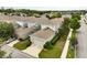 Beautiful two-story home featuring a two-car garage, manicured lawn, and mature landscaping at 6834 Habitat Dr, Harmony, FL 34773