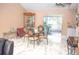 Combined living and dining room space with modern tile flooring, a fireplace, and sliding glass door at 7410 Orange Crest Cir, Lakeland, FL 33810