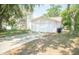 Classic single-story home with a two-car garage, showcasing its traditional design at 7410 Orange Crest Cir, Lakeland, FL 33810