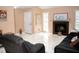 Spacious living room features a brick fireplace, a tile floor, and comfortable seating at 7410 Orange Crest Cir, Lakeland, FL 33810