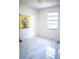 Bright room with marble floor, natural light, and yellow accent art at 7410 Orange Crest Cir, Lakeland, FL 33810