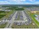 Aerial shot of a Primary-planned community with modern homes, solar panels, and well-organized streets under a sunny sky at 757 Citrus Reserve Blvd, Davenport, FL 33837