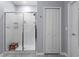 Bathroom features a tiled glass enclosed shower with bench, and linen closet at 757 Citrus Reserve Blvd, Davenport, FL 33837