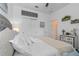 Bedroom features a comfortable bed with white linens and beige throw, with dual closets and decor at 757 Citrus Reserve Blvd, Davenport, FL 33837