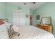 Bedroom showcasing mint green walls, closet, and side view of a vanity at 757 Citrus Reserve Blvd, Davenport, FL 33837