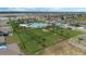 Aerial view showcasing community amenities including a pool, dog park, and grassy areas, surrounded by modern homes at 757 Citrus Reserve Blvd, Davenport, FL 33837
