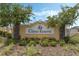 A welcoming entrance sign for 'Citrus Reserve' is surrounded by lush landscaping and healthy green trees at 757 Citrus Reserve Blvd, Davenport, FL 33837