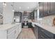 Modern kitchen featuring stainless steel appliances, white countertops, and stylish gray cabinetry at 757 Citrus Reserve Blvd, Davenport, FL 33837