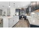 Modern kitchen featuring stainless steel appliances, white countertops, and stylish gray cabinetry at 757 Citrus Reserve Blvd, Davenport, FL 33837