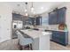 Modern kitchen featuring stainless steel appliances, a marble island, and stylish gray cabinetry at 757 Citrus Reserve Blvd, Davenport, FL 33837