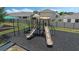 Playground area with slides, climbing structures, and soft landing, perfect for recreation at 757 Citrus Reserve Blvd, Davenport, FL 33837