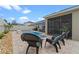 Inviting backyard oasis featuring a sparkling pool, stone patio, and comfortable lounge seating at 757 Citrus Reserve Blvd, Davenport, FL 33837