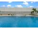 Beautiful pool with a water feature and lush landscaping, creating a serene backyard retreat at 757 Citrus Reserve Blvd, Davenport, FL 33837