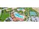 Aerial view of community amenities including pools, tennis courts, and recreation areas at 7622 Oakmoss Loop, Davenport, FL 33837