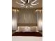 Bedroom with a stylish decorative wall, pendant lighting and a well made king bed at 7622 Oakmoss Loop, Davenport, FL 33837