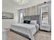Comfortable bedroom featuring a large bed with plush bedding, soft carpet, and natural light at 7622 Oakmoss Loop, Davenport, FL 33837