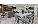 Elegant dining area featuring stylish decor, including a modern dining table, seating, and contemporary lighting at 7622 Oakmoss Loop, Davenport, FL 33837