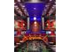 The game room features custom lighting, arcade games, a foosball table, and air hockey for ultimate entertainment at 7622 Oakmoss Loop, Davenport, FL 33837