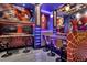 Custom decorated game room features wet bar, stools and Spider-Personal décor at 7622 Oakmoss Loop, Davenport, FL 33837