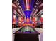 Centered foosball table with custom theming and arcade games, providing an inviting space for friendly competition at 7622 Oakmoss Loop, Davenport, FL 33837