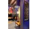 This unique game room features themed wall art, cozy seating, and stylish lighting, blending entertainment with comfort at 7622 Oakmoss Loop, Davenport, FL 33837