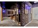 Finished basement with custom-themed home theater room and brick accents at 7622 Oakmoss Loop, Davenport, FL 33837