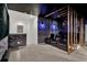 Finished basement with custom-themed home theater and wood accents at 7622 Oakmoss Loop, Davenport, FL 33837