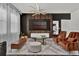 Open-concept living room with stylish furnishings, modern lighting, and a seamless flow to the kitchen at 7622 Oakmoss Loop, Davenport, FL 33837