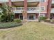View of the backyard featuring a patio with outdoor seating and manicured green spaces at 7650 Whisper Way # 102, Reunion, FL 34747